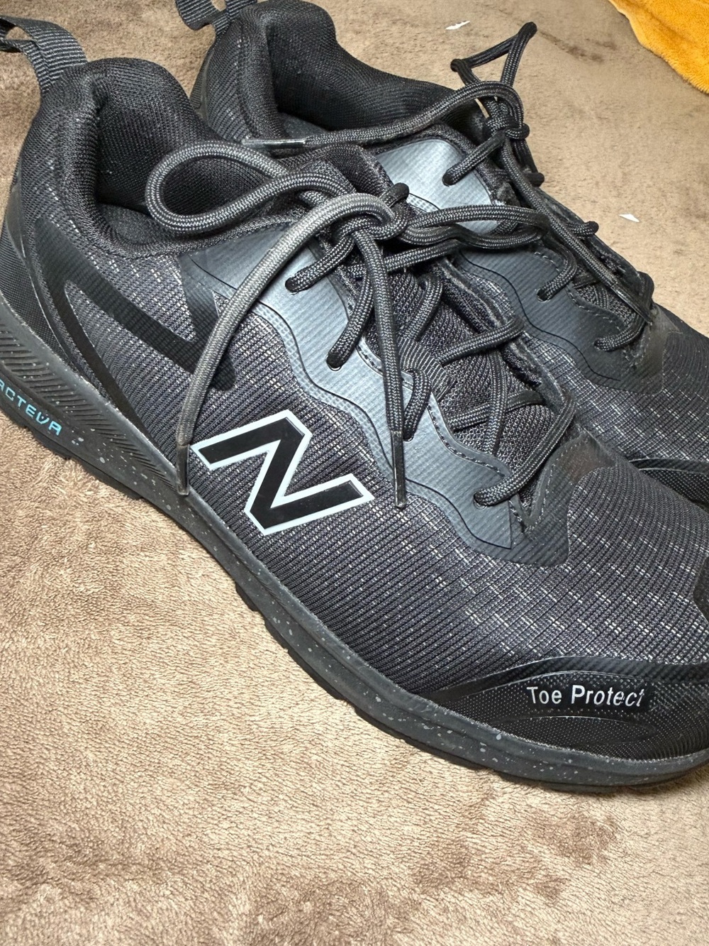 New Balance Men's Black Athletic Sneakers with White N Logo